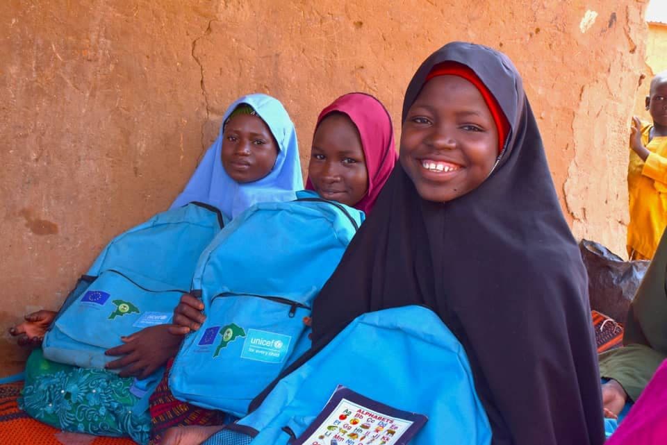 Girls enrolled in the Accelerated Basic Education Programme with their school bags