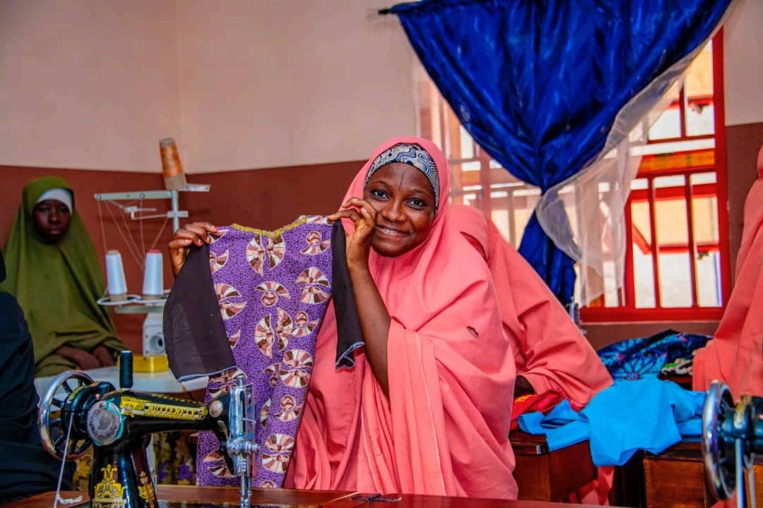Trainee at the Gidan Arziki vocational centre showing fabric she sewed