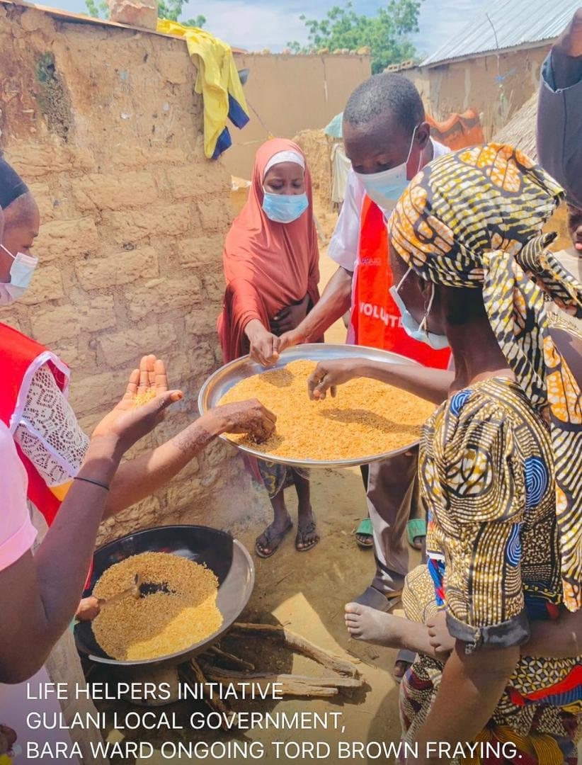 Women preparing Tom Brown, a local weaning food, in Bara Ward, Gulani LGA, Yobe State