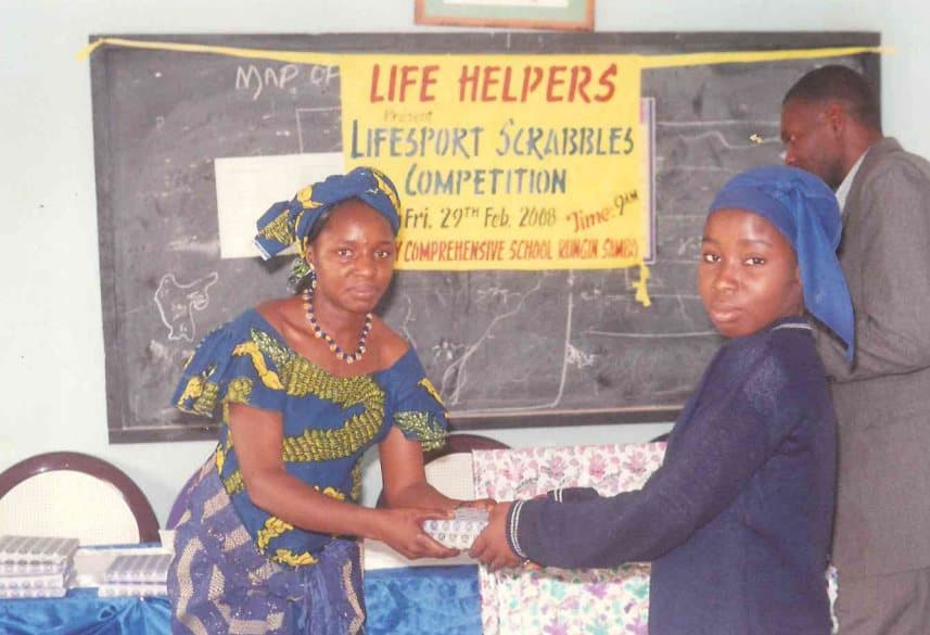 A student receiving her prize at the 2008 Lifesport Scrabbles Competition