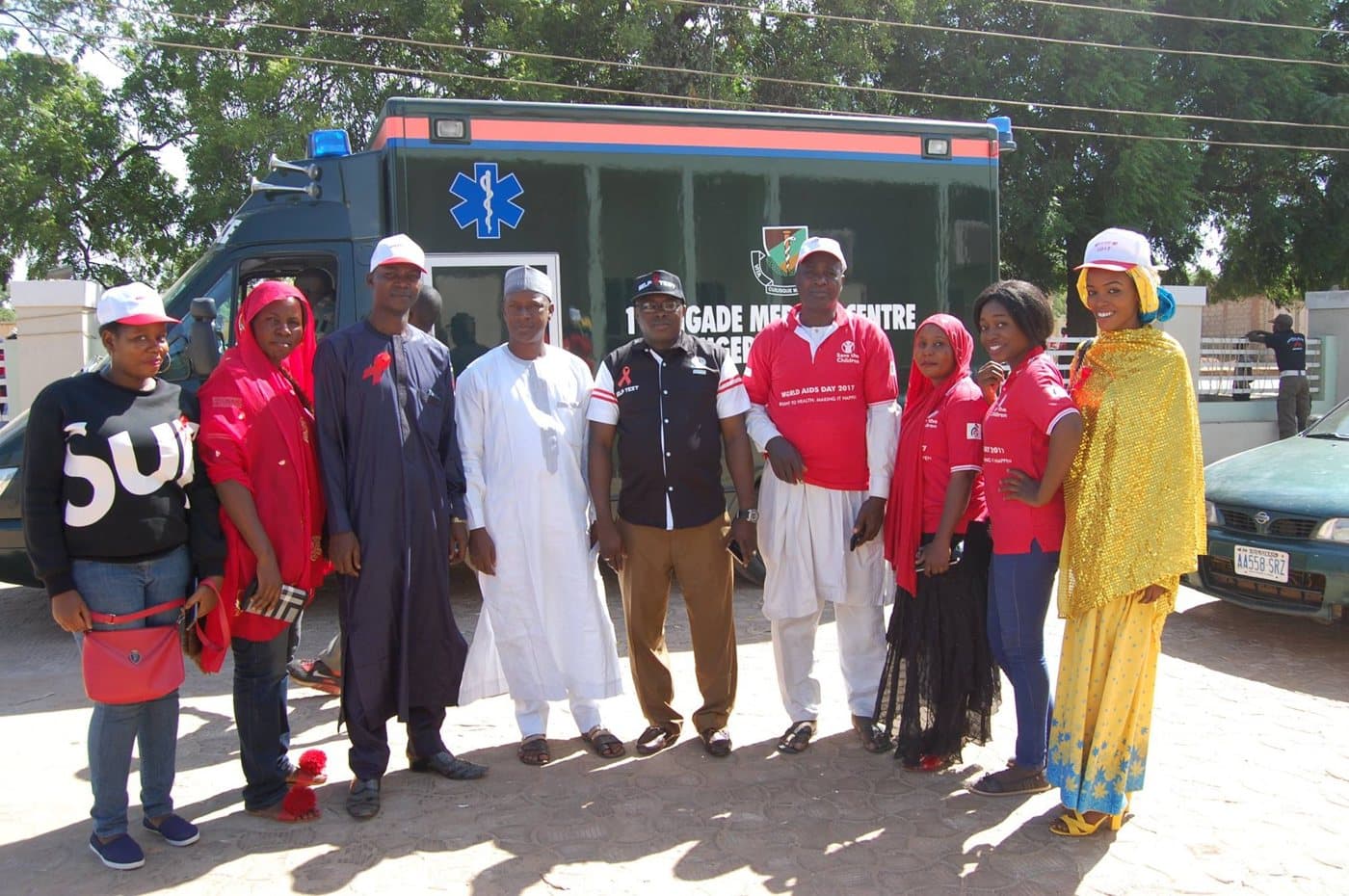 LHI team and partners beside an ambulance on World AIDS Day 2017