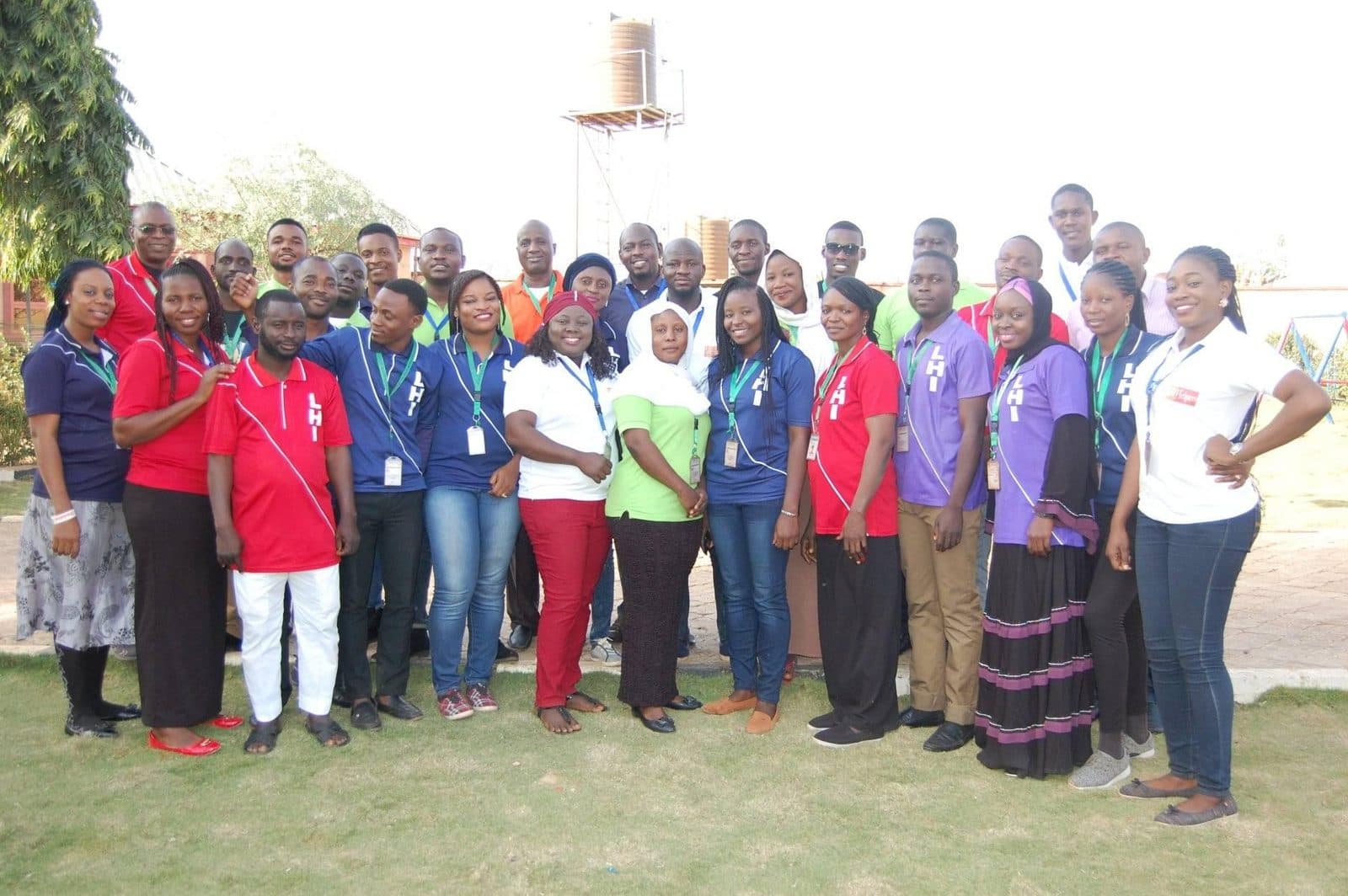 The full Life Helpers team in LHI shirts at the 2018 staff retreat