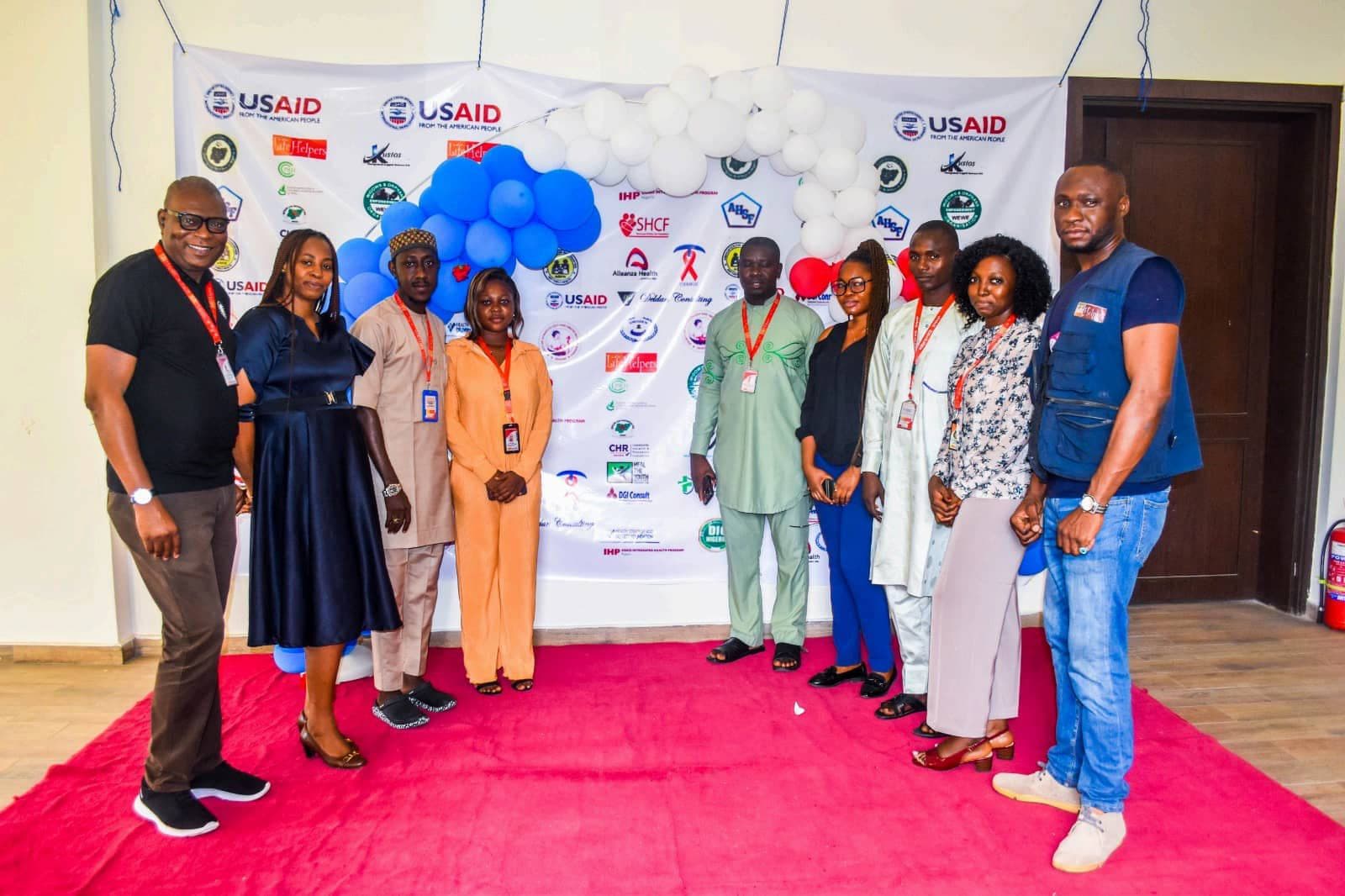 LHI team with partners at a USAID-supported event