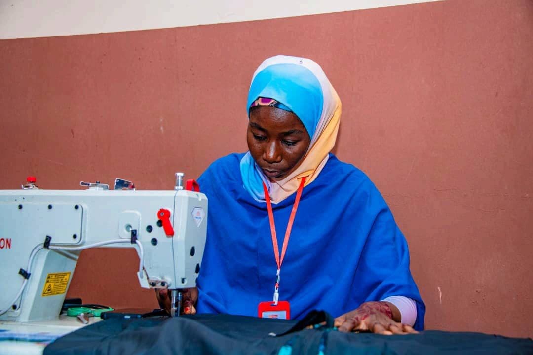 Sewing trainee at work on an industrial sewing machine