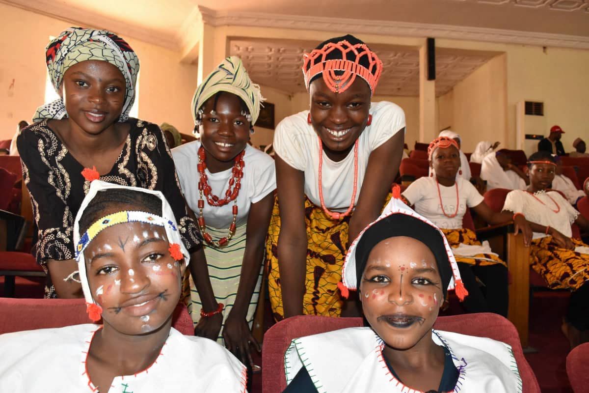 Smiling adolescent girls at an LHI girls' empowerment event