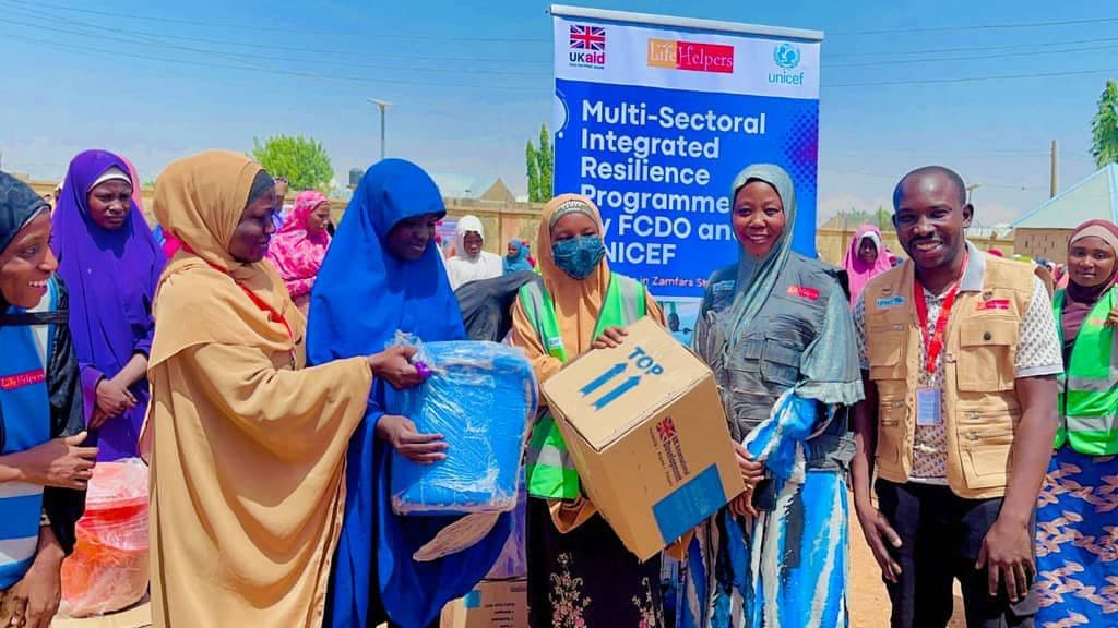 LHI team distributing kits under the FCDO/UNICEF MIRP programme