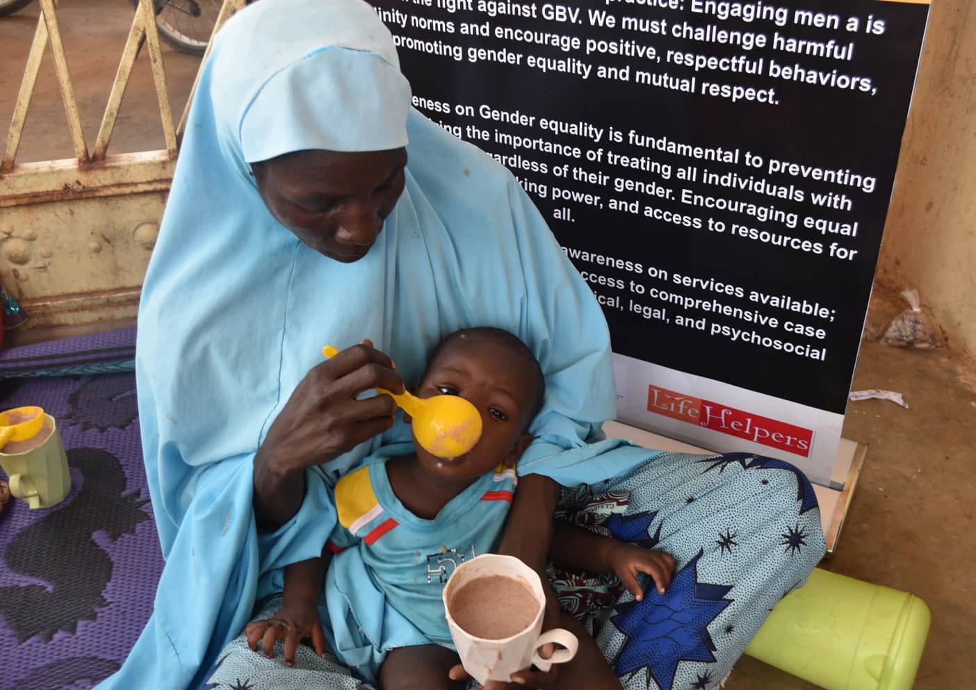 Mother feeding her child during a nutrition session