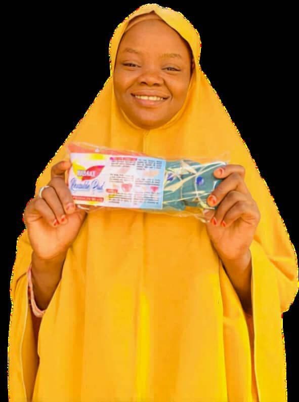 Young woman holding a pack of NIDAKE reusable sanitary pads