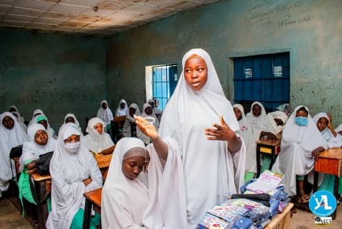 Girls in a classroom during a NIDAKE menstrual hygiene education session